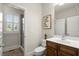 Bright bathroom featuring a vanity, toilet, and walk-in shower at 11240 Avery Cove Ct, Alpharetta, GA 30022