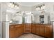 Bright bathroom featuring a large vanity with double sinks and storage at 11240 Avery Cove Ct, Alpharetta, GA 30022