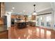 Gourmet kitchen with hardwood floors, stainless steel appliances, and an island with seating at 11240 Avery Cove Ct, Alpharetta, GA 30022