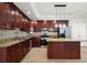 Gourmet kitchen with granite countertops, stainless steel appliances, and a spacious island at 11240 Avery Cove Ct, Alpharetta, GA 30022