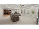Spacious living room features large windows, recessed lights and an adjoined kitchen at 11240 Avery Cove Ct, Alpharetta, GA 30022