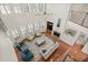 Open-concept living room showcasing high ceilings, hardwood floors, and lots of natural light at 11240 Avery Cove Ct, Alpharetta, GA 30022