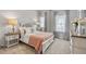 Charming bedroom with neutral colored walls, carpet, and lots of natural light at 123 Ravencliff Dr # 80, Austell, GA 30168