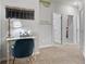 Hallway with a desk, chair, and lamp near a chalkboard calendar with 9ft ceilings at 123 Ravencliff Dr # 80, Austell, GA 30168