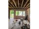 Interior of a living room undergoing renovation, showing a view of other house across the street at 2545 Saint Patrick Se St, Atlanta, GA 30317