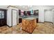 Well-lit kitchen featuring a center island with butcher block detail and granite countertops at 2711 Mcdonough Rd, Hampton, GA 30228