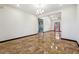 Open-concept living space featuring bright neutral walls and unique tile flooring at 2711 Mcdonough Rd, Hampton, GA 30228