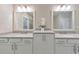Bathroom featuring double vanity with quartz countertops and modern lighting at 396 Summerhour St, Marietta, GA 30060