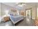 Well-lit bedroom with hardwood floors, neutral walls, and a plush bed creating a cozy and inviting atmosphere at 396 Summerhour St, Marietta, GA 30060