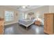 Serene bedroom with natural light, hardwood floors, neutral walls, and tasteful decor, creating a peaceful retreat at 396 Summerhour St, Marietta, GA 30060