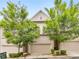 Charming townhome with well-maintained landscaping, a brick facade, and an attached two-car garage at 396 Summerhour St, Marietta, GA 30060