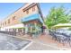 Inviting exterior with a Taqueria restaurant featuring outdoor seating on a brick-paved sidewalk at 396 Summerhour St, Marietta, GA 30060