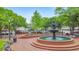 Water fountain surrounded by park benches and mature trees at 396 Summerhour St, Marietta, GA 30060