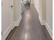 Inviting hallway with hardwood floors and white trim leading to a dining area at 396 Summerhour St, Marietta, GA 30060