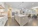 Open-concept kitchen with a large island, stainless steel appliances, and stylish pendant lighting at 396 Summerhour St, Marietta, GA 30060