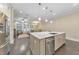 Open kitchen flowing into the living area, featuring a large island and modern appliances at 396 Summerhour St, Marietta, GA 30060