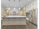 Bright kitchen with a large center island, stainless steel appliances, and ample cabinet space at 396 Summerhour St, Marietta, GA 30060