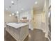 Kitchen with a large island, stainless steel appliances, and white cabinets, perfect for entertaining at 396 Summerhour St, Marietta, GA 30060