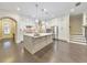 Spacious kitchen featuring white cabinets, a large island, and stainless steel appliances at 396 Summerhour St, Marietta, GA 30060