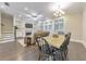 Cozy living room featuring a fireplace, custom built-ins, and dining area bathed in natural light at 396 Summerhour St, Marietta, GA 30060