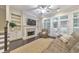 Inviting living room featuring built-in bookshelves, a cozy fireplace, and glass doors leading to the outdoor space at 396 Summerhour St, Marietta, GA 30060