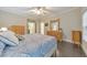 Bright bedroom with hardwood floors, a cozy queen-size bed, and wooden furniture creating a comfortable and stylish space at 396 Summerhour St, Marietta, GA 30060