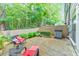 Inviting patio area with seating and lush greenery, creating a tranquil outdoor space at 396 Summerhour St, Marietta, GA 30060