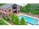 Aerial view of the pool area with lounge chairs and covered patio space at 396 Summerhour St, Marietta, GA 30060