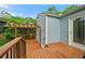 A wooden back deck with a pergola offers an inviting space next to the home's side entrance at 511 Robinson Se Ave, Atlanta, GA 30315