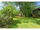 Large grassy backyard, mature foliage, and a shed, perfect for outdoor activities and relaxing in a lush environment at 511 Robinson Se Ave, Atlanta, GA 30315