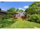 Large green backyard with a wooden deck featuring a pergola, great for enjoying the outdoors or entertaining guests at 511 Robinson Se Ave, Atlanta, GA 30315