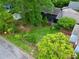 Aerial view of a beautifully landscaped backyard with lush greenery, a privacy fence, and a deck at 511 Robinson Se Ave, Atlanta, GA 30315