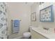 Clean bathroom features blue accents and a shower with tub at 511 Robinson Se Ave, Atlanta, GA 30315