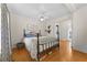 Bedroom with hardwood floors, ceiling fan, and a view to laundry room at 511 Robinson Se Ave, Atlanta, GA 30315