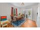 Dining room with hardwood floors, natural light, and a view into the kitchen at 511 Robinson Se Ave, Atlanta, GA 30315