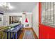 Bright entryway featuring hardwood floors, storage, and a striking red front door at 511 Robinson Se Ave, Atlanta, GA 30315