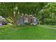 Charming blue home featuring a lush, well-maintained front yard at 511 Robinson Se Ave, Atlanta, GA 30315
