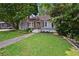 Inviting home with well-manicured lawn, landscaping, and a cozy front porch at 511 Robinson Se Ave, Atlanta, GA 30315
