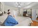 Cozy main bedroom featuring hardwood floors, a ceiling fan, and natural light at 511 Robinson Se Ave, Atlanta, GA 30315