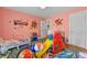Fun playroom with colorful wall decals, a slide, and various toys for imaginative play at 511 Robinson Se Ave, Atlanta, GA 30315