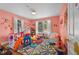bedroom features bright walls, a colorful rug, and -friendly furnishings at 511 Robinson Se Ave, Atlanta, GA 30315