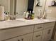 Bathroom featuring double sinks, white cabinets and granite counters at 8315 Loch Lomand Ln, Winston, GA 30187