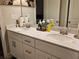 Bathroom featuring double sinks, white cabinets and granite counters at 8315 Loch Lomand Ln, Winston, GA 30187
