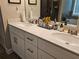Bathroom vanity with double sinks, marble countertop, and modern hardware at 8315 Loch Lomand Ln, Winston, GA 30187