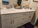 Bathroom vanity with double sinks, marble countertop, and modern hardware at 8315 Loch Lomand Ln, Winston, GA 30187