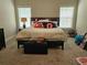Cozy bedroom with neutral carpet, queen bed, and lots of natural light at 8315 Loch Lomand Ln, Winston, GA 30187