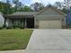 Charming one-story home with a two-car garage, manicured lawn, and inviting curb appeal at 8315 Loch Lomand Ln, Winston, GA 30187
