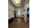 Inviting foyer with wood floors, wainscotting, and stylish decor at 8315 Loch Lomand Ln, Winston, GA 30187