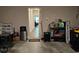 Well-organized garage featuring storage solutions and a view into a brightly lit home interior, maximizing space and functionality at 8315 Loch Lomand Ln, Winston, GA 30187