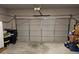 Spacious garage with a modern door and ample room for parking and storage, enhancing home convenience at 8315 Loch Lomand Ln, Winston, GA 30187